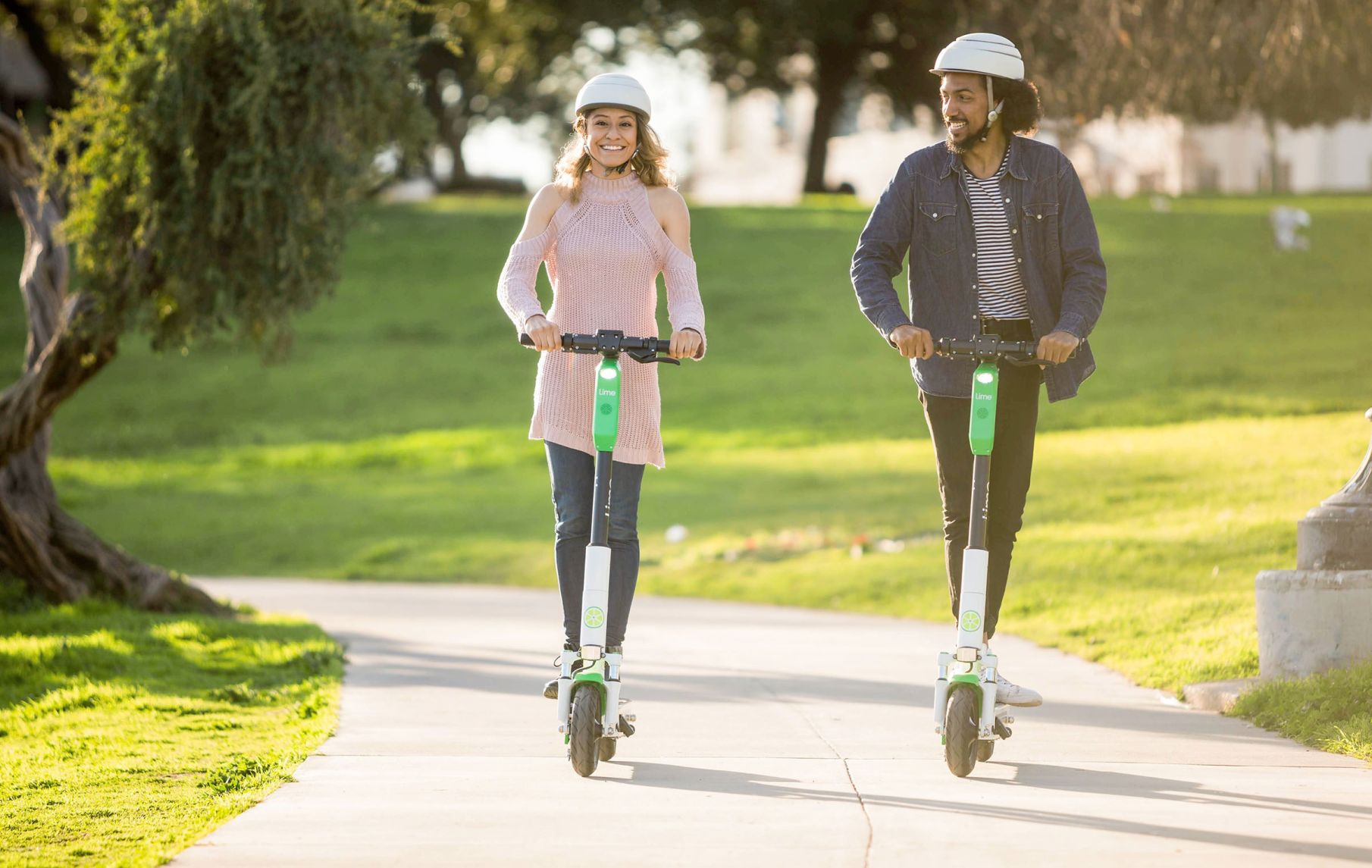 012220_MNS_Lime_leaves man and woman on e-scooters
